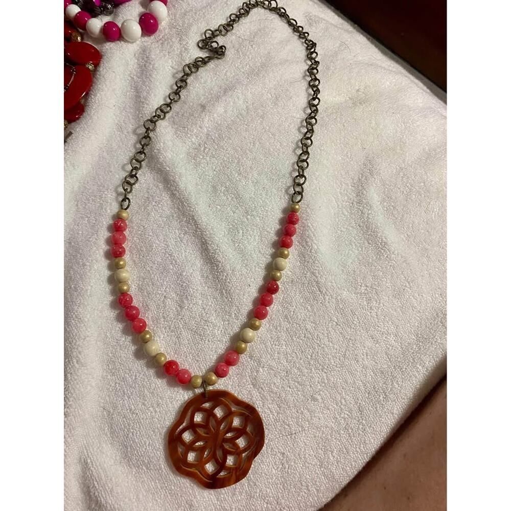Pink/white/gold beaded necklace on Goldtone chain with tortoise toned flower